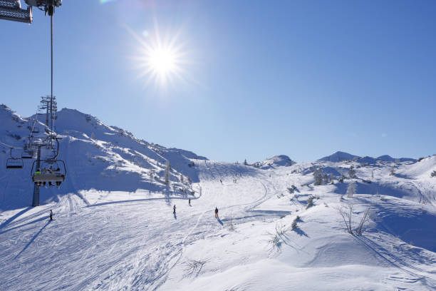 istock skiers rushes down a snowy slope 1367646201