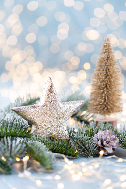 istock Christmas spruce with star and blurred shiny lights. 1367647344