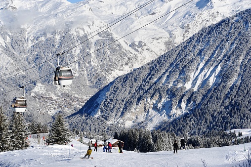 Ski resort view with snowy forest and vintage ski gondolas