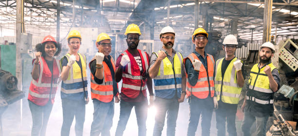 istock Engineering team with technician and worker operating. Group photo in factory, teamwork concept. 1367651160