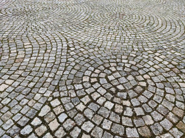 istock stone paving stones on kaliningrad street. Stone paving texture. Abstract structured background. 1367651325