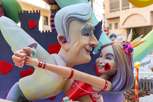 Scene of a Falla during Las Fallas Festival on September 3, 2021 in Valencia, Spain. The Fallas is Valencias most international festival, which runs from March 15 until March 19, but because the COVID, in 2021 was celebrated in september. It celebrates the arrival of spring with fireworks, fiestas and bonfires made by large puppets named Ninots. During the months preceding this unique festivity, a lot of hard work and dedication is put into preparing the monumental and ephemeral cardboard statues that will be devoured by the flames. The festival has been designated as a UNESCO Intangible Cultural Heritage of Humanity since 2017.