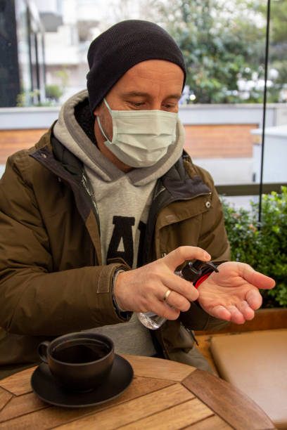 istock Disinfecting hands in pandemic days 1367654863