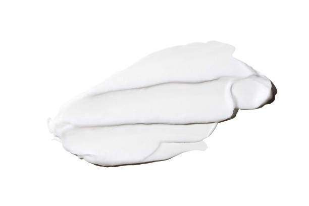 Liquid white cream smear isolated on white background. Beauty cosmetic smudge such as hair conditioner, creamy lotion, facial retinol serum, mask balm, cleanser, shower gel or shampoo top view Liquid white cream smear isolated on white background. Beauty cosmetic smudge such as hair conditioner, creamy lotion, facial retinol serum, mask balm, cleanser, shower gel or shampoo top view. lotion texture stock pictures, royalty-free photos & images