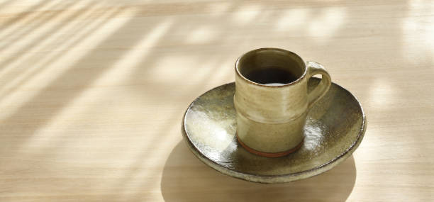 istock A cup of coffee on a wooden table 1367656996