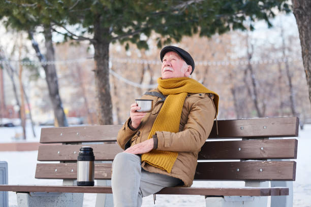 istock Pensioner enjoying the hot tea outdoors 1367657190