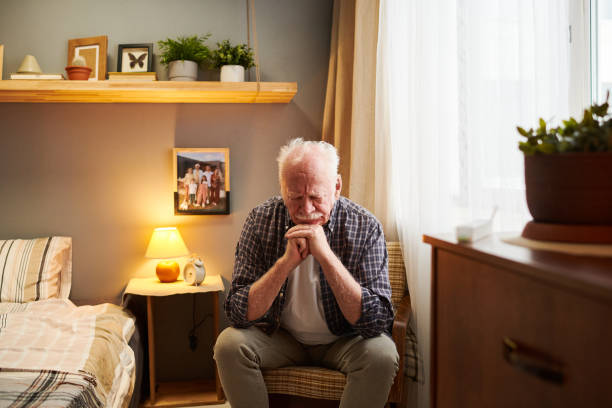 istock Senior man resting in armchair 1367657193