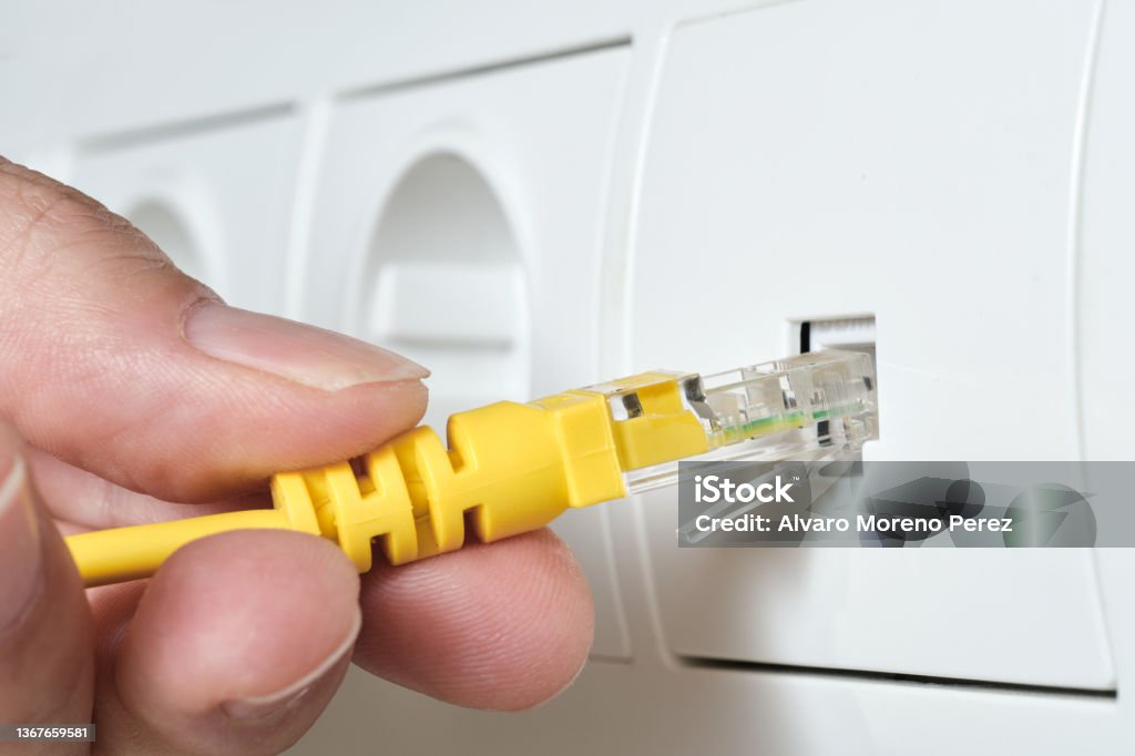Cable Into Socket Hand Plugging Rj45 Ethernet Cable Into A Network Socket Stock Photo ...
