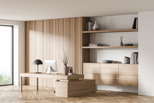 Workplace room interior with wooden furniture, computer pc and books on shelf, parquet floor. Working space with desk in apartment, 3D rendering