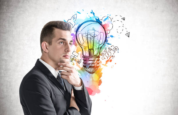 istock Thoughtful businessman and business idea sketch 1367662063