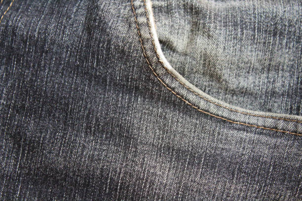 istock Denim. Old, faded black jeans. Close-up. Background. Texture. 1367662302