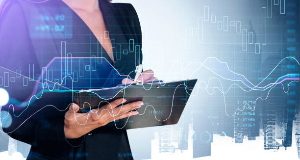 istock Businessman in formal suit is taking notes on clipboard 1367662541
