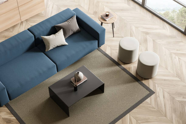 istock Minimalist relaxing room interior with sofa and coffee table near window, top view 1367662618