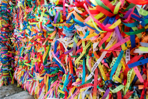 istock Thousands of colored ribbons tied to a gate. 1367663624