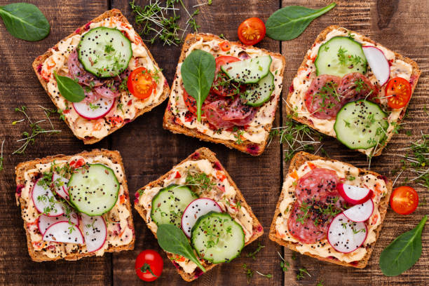 istock Sandwiches with cream cheese, vegetables and salami. 1367663917