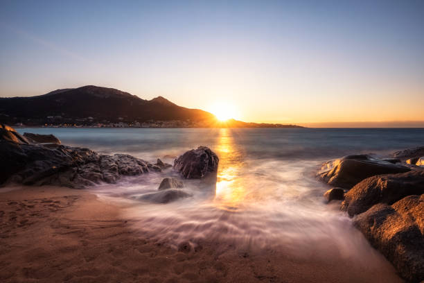 Aregno beach at sunset in Corsica stock photo