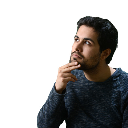 Portrait of thoughtful young man in casual style thinking