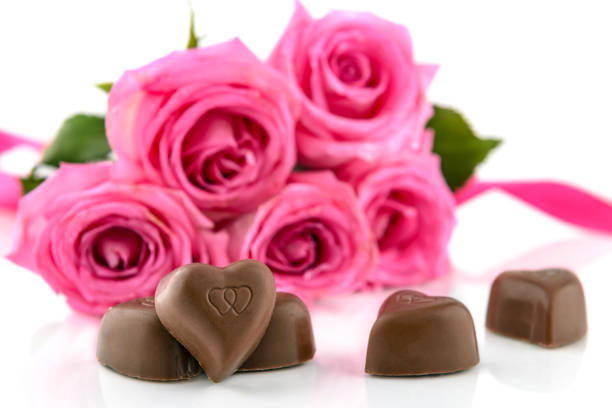 istock Chocolate and pink roses 1367665581