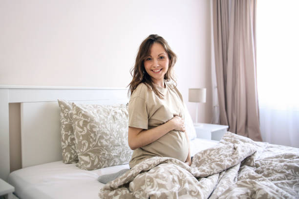 istock Smiling pregnant woman 1367666260