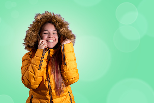 Banner. Happy woman talking on the phone. Green background