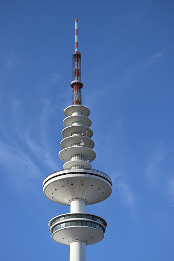 Hamburg, Germany, February 5, 2020: Television tower called Heinrich Hertz Tower against a blue sky, copy space