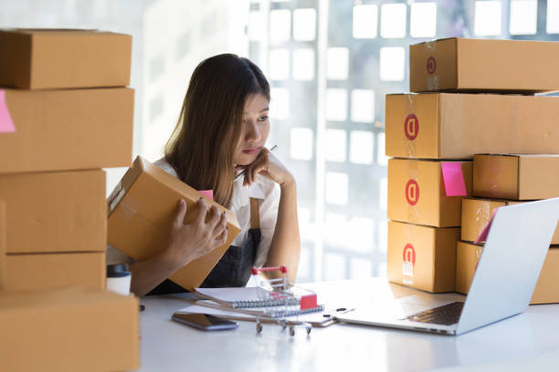 istock A woman starting a small ecommerce business at work is thinking and contemplating a commerce strategy. 1367670757
