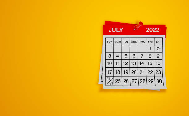 Calendar 2025, July, monthly planner. Day, month, year, date and activity organiser wall and desk planner. Red and white calendar with large letters and numbers on wooden background.