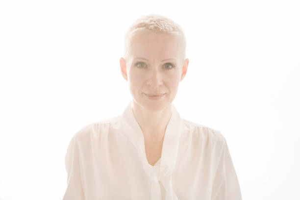 Portrait of confident backlit woman.