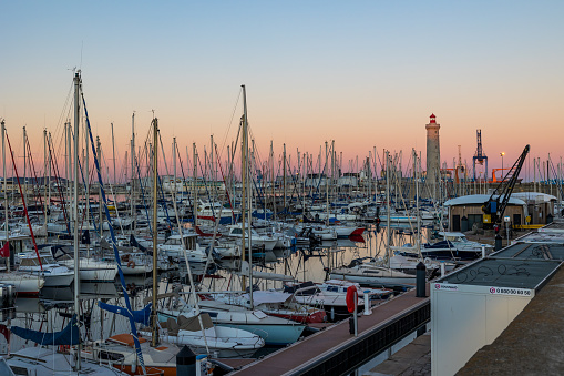View of the marina of Sète and the Phare Saint-Louis from the Môle Saint-Louis at sunset