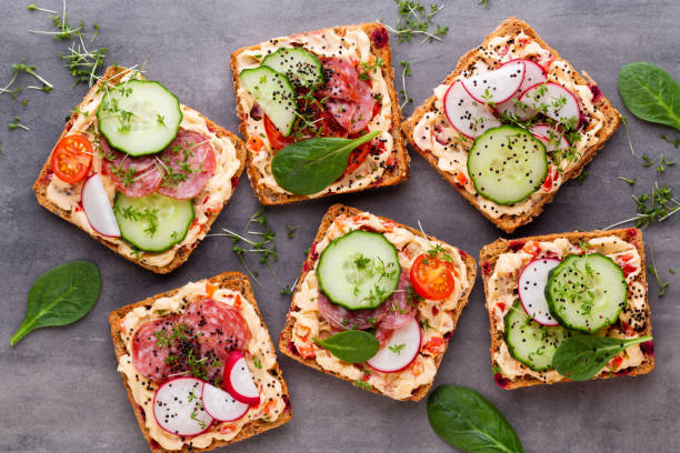 istock Sandwiches with cream cheese, vegetables and salami. 1367676297
