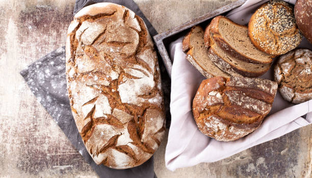 istock Sliced rye bread on cutting board, closeup. 1367676431