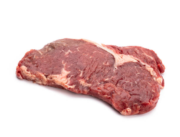 istock Fresh raw  steaks isolated on white background................. 1367676629