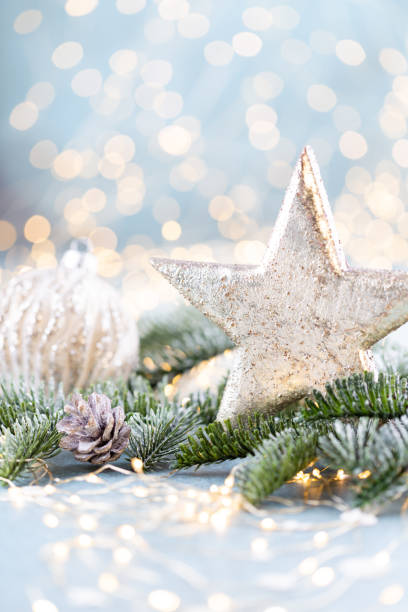 istock Christmas spruce with star and blurred shiny lights. 1367676692