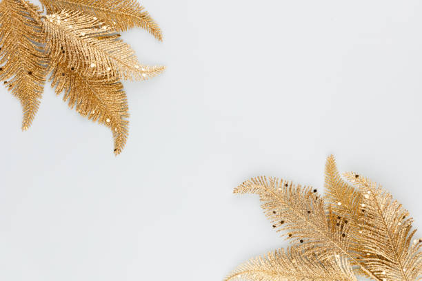 istock Palm gold leaf on blue background. Palm leaf, Flat lay and top view. 1367676779