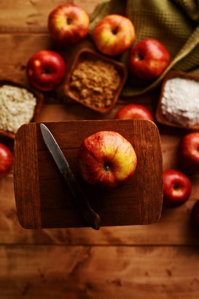 istock organic royal gala apple on small cutting board 1367678075