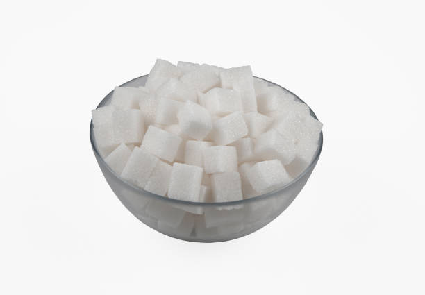 istock White sugar cubes in a glass bowl, on a white background 1367678245