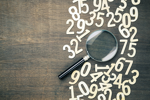 Magnifying glass in scattered numbers