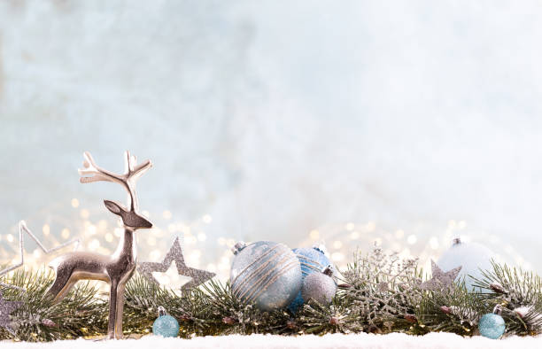 istock Christmas ornament with string lights on blue background. 1367680817
