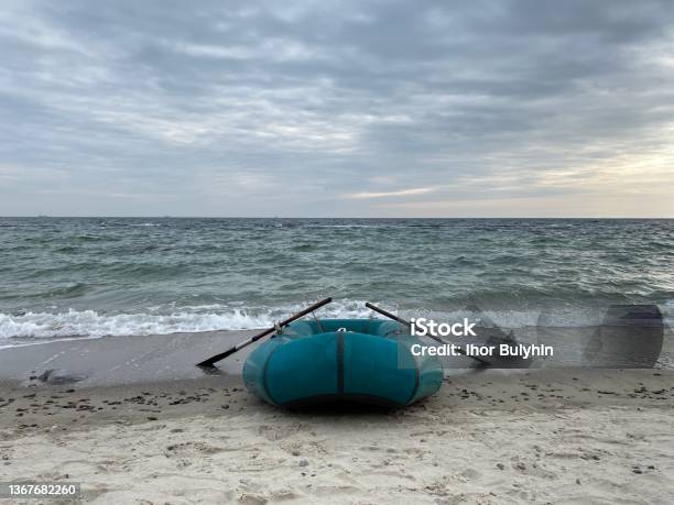 Boad Photo Inflatable Boad On The Beach On Sunset Stock Photo - Download Image Now ...