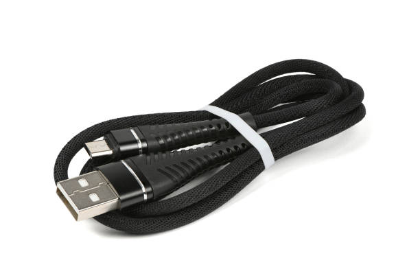 istock Black USB cable for charging a smartphone isolated on white. 1367682369