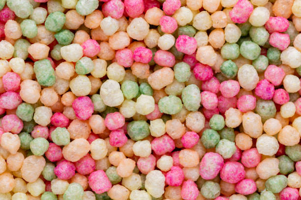 istock Thousands sprinkles tiny sugar beads for decorating cakes and desserts background. 1367683845