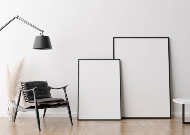 istock Two empty vertical picture frames in modern living room. Mock up interior in contemporary style. Free space for picture, poster. Armchair, lamp, vase with pampas grass. 3D rendering. 1367684559