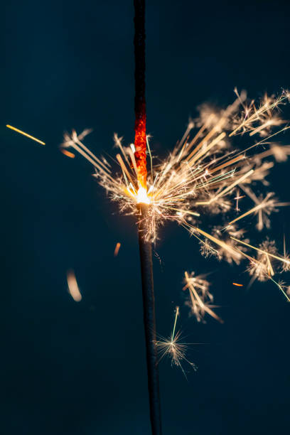 istock Christmas bengal fire sparkles against the black background. 1367684739