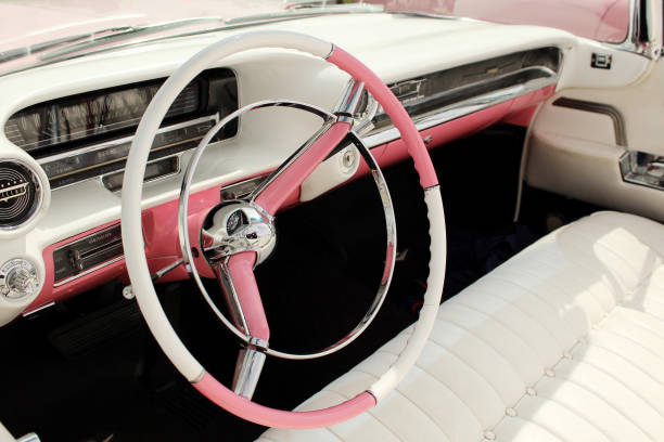 Luton, UK - June 2019: Retro pink and white retro Cadillac interior at a classic car show.