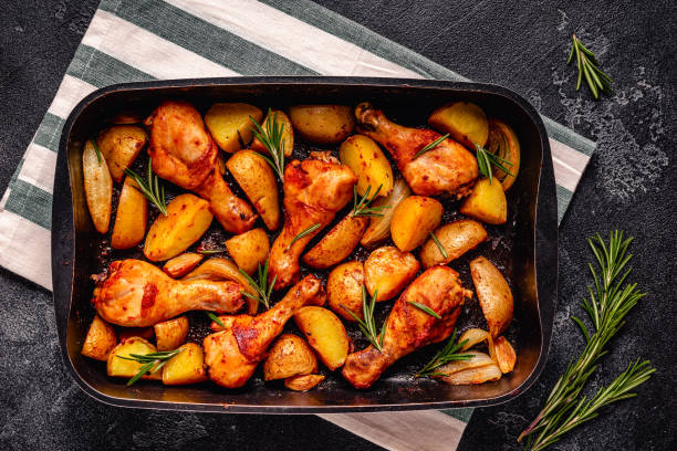 istock Roasted chicken legs with potatoes and rosemary. 1367685060
