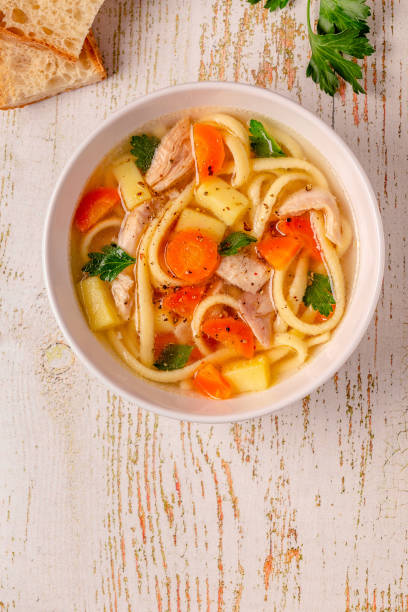 istock Chicken soup with noodles and vegetables 1367685904