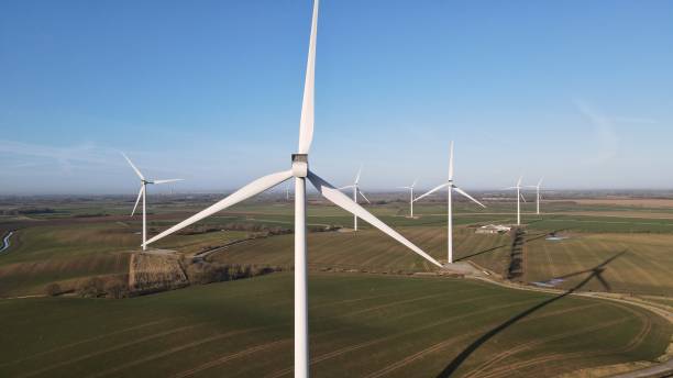 istock Wind Turbines in sunny field 1367685953