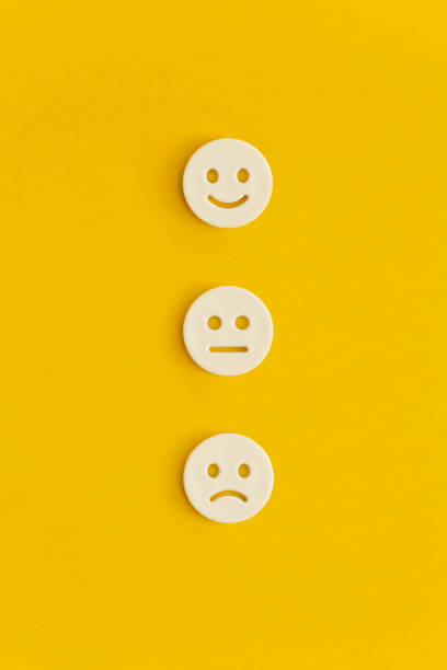 istock Emoticon smile on a yellow background. Customer feedback. 1367690617