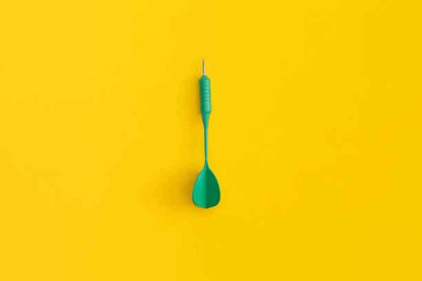 istock Dart on a yellow background. Top view. Flat lay. 1367690620
