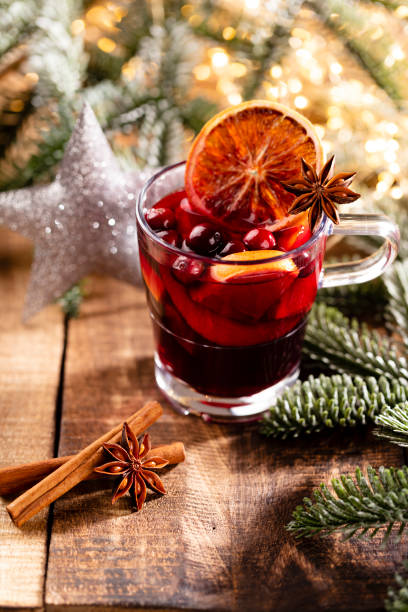 istock Christmas mulled wine with spices on a wooden rustic table. 1367690997